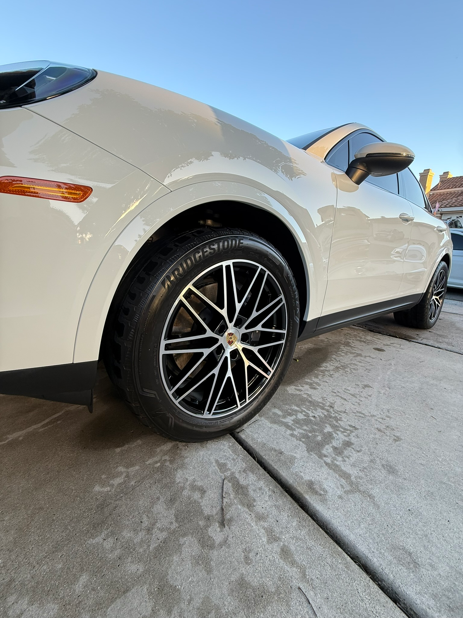 Luxury Porsche showing professional wheel detailing and exterior ceramic coating shine